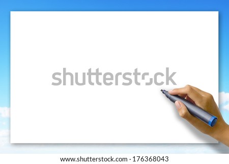 Woman's hand writing on a blank card 