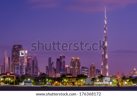 UAE, The United Arab Emirates: Downtown Dubai at violet spectacular nice sunset. Burj Khalifa, the tallest building in world.  Amazing beautiful modern skyscrapers  built in desert. Skyline from beach