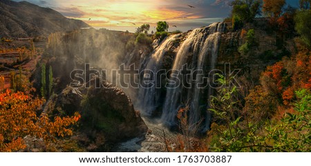 Panoramic image of Tortum (Uzundere) waterfall from down in Uzundere. Landscape view of Tortum Waterfall in Tortum,Erzurum,Turkey. Explore the world's beauty and wildlife.  Royalty-Free Stock Photo #1763703887