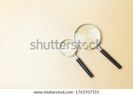 magnifying glass on yellow texture background.
