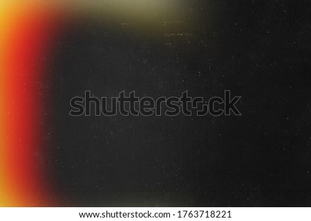 Red blur effect on black background. Imitation old analog photo texture. 20s Royalty-Free Stock Photo #1763718221