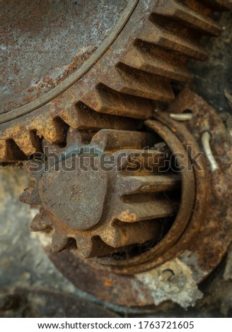 Gears of historic agricultural machinery.