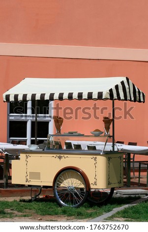 trolley with wheels for the sale of ice cream and ready cones