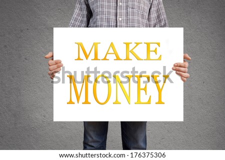 Person holding white banner with make money message.