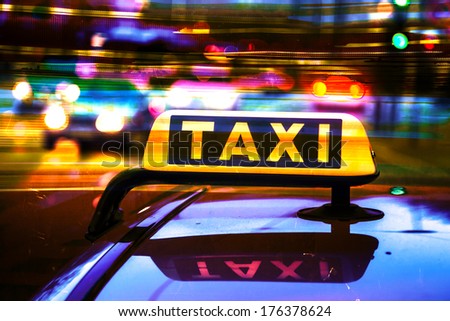 artistic processed picture of a taxi sign at night
