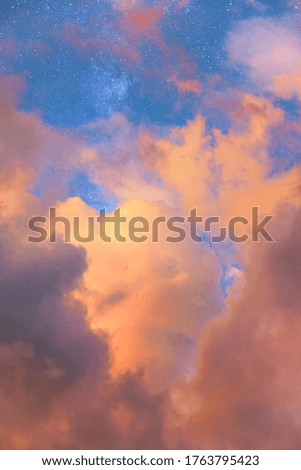 Sunset clouds with a blue sky with stars