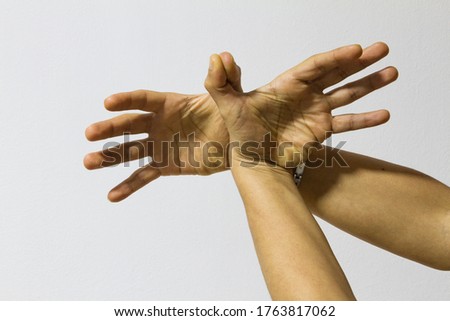 Human hands making gestural signs