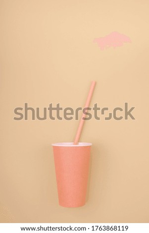 The concept of rejection of plastic. Zero waste, environmental theme. Disposable paper cup on a beige background with copy space.