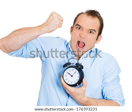 Closeup portrait of angry, demanding boss, business man, funny looking guy, holding alarm clock, screaming, requesting employees to be on time pushing for project deadline isolated on white background