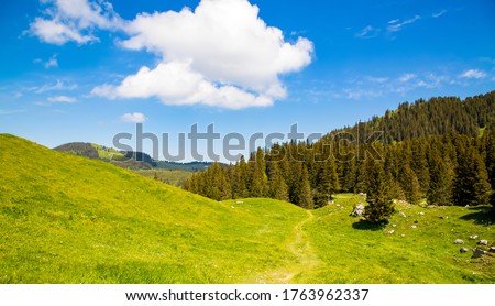 Landscape view of Gantrischseeli at the Switzerland nature park, Natural scenery with a river in the middle between the mountains. On a clear day in the summer sky, for travel and holiday vacations.