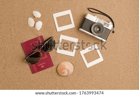 vacation, travel and summer vacation concept: retro photo camera, spiral shell, sunglasses over passport, on the beach sand Set of square photo frames. Photographic design illustration