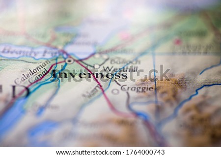 Shallow depth of field focus on geographical map location of Inverness city England United Kingdom Great Britain Europe continent on atlas