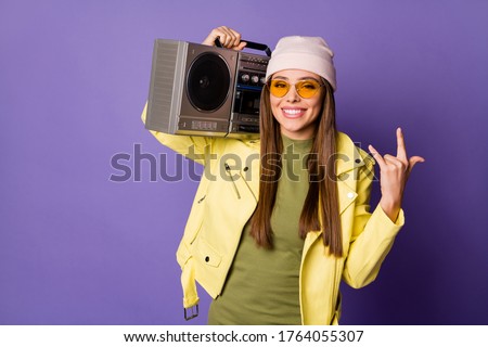 Portrait of her she nice attractive lovely fashionable cool cheerful girl dancing carrying player showing horn sign isolated over bright vivid shine vibrant lilac purple violet color background