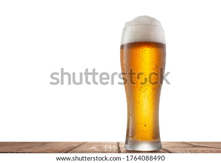 Glass of beer on the table with isolated background