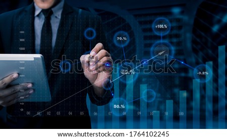 Double exposure of businessman working on digital tablet with digital marketing virtual chart, Abstract icon, Business technology concept, Background toned image blurred.