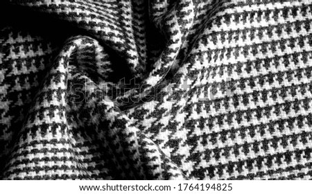 Background texture, pattern. The fabric is thick, warm with a checkered pattern, gray black. This is an unforgettable encounter with my fabric. The best design solutions are waiting for you.