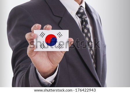 Businessman holding a business card with South Korea Flag 