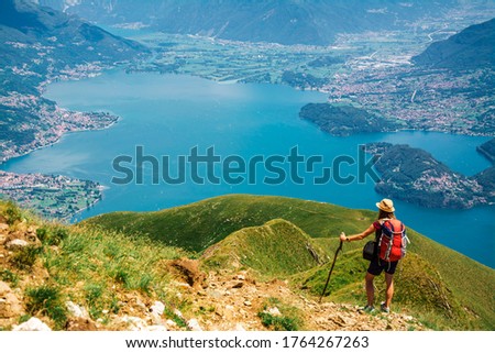 Young tourist woman enjoying the view of Alps in the area of Como Lake, Lombardy, Italy Royalty-Free Stock Photo #1764267263