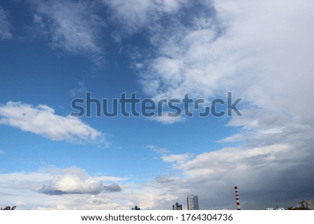 Blue sky in the evening with easy light clouds. Aerial view .