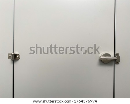 White door in the toilet at oil pump