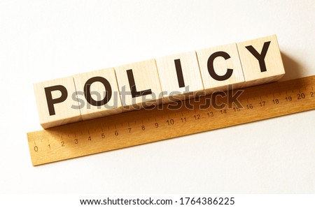 Word POLICY made with wood building blocks.business concept