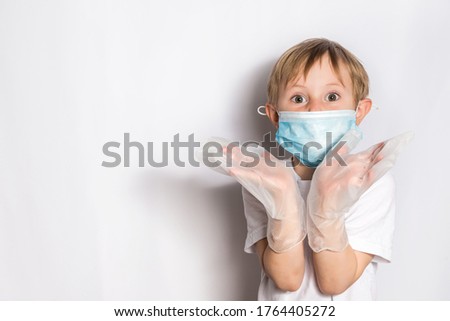 Cute Little Girl in medical maskwith stethoscope isolated. On white background, in a white base T-shirt, copy space, banner.