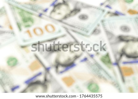 Money stack soft focus. 100 Hundred dollars of USA. American paper cash abstract blur background, usd bill.