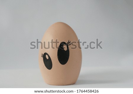 brown egg shell with funny face