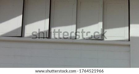 white windows and light shadow