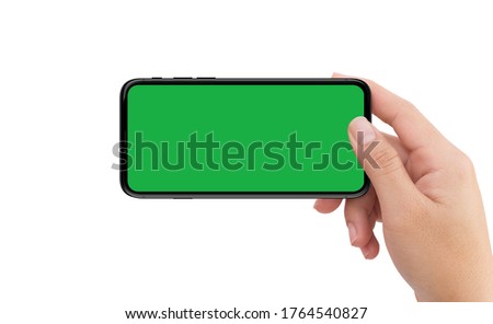 Isolated human left hand holding black mobile smart phone device mockup green screen