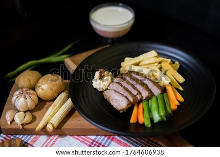 Main course menu is beef steak with vegetables