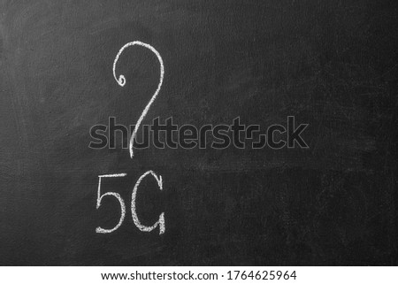 5g inscription and question mark on a chalk board