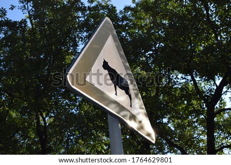 Old road sign: danger crossing cows