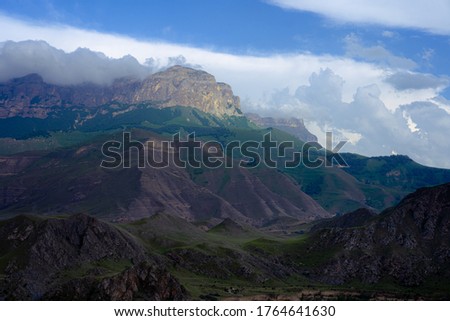 Mountains against the sky and clouds Royalty-Free Stock Photo #1764641630