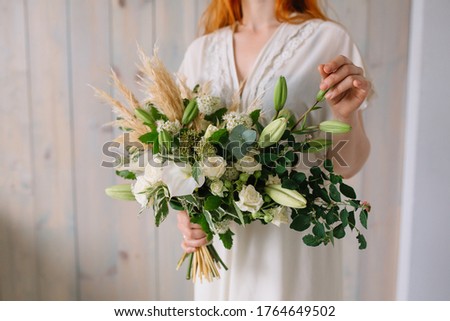 
Bridal bouquet of wildflowers with lily, rose, green and yellow