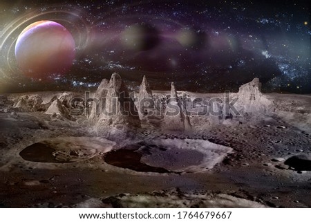 
Alien planet landscape with craters, mountains and moons. Elements of this image furnished by NASA.