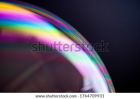 Macro photography of soap bubbles on dark background