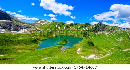 Lake Schrecksee - A beautiful turquoise alpine lake in the Allgaeu alps near Hinterstein, hiking destination in Bavaria, Germany Royalty-Free Stock Photo #1764714689