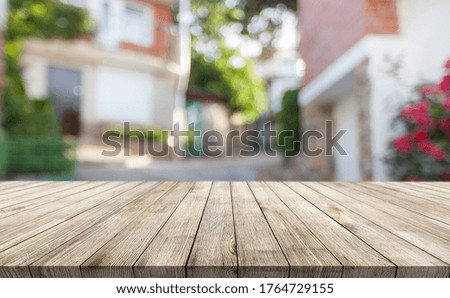 Wooden desk on blur or abstract natural background