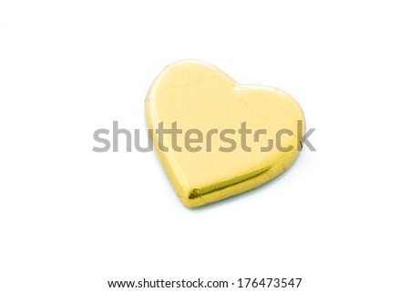 Chocolate heart isolate wrapped in gold foil isolate on white background