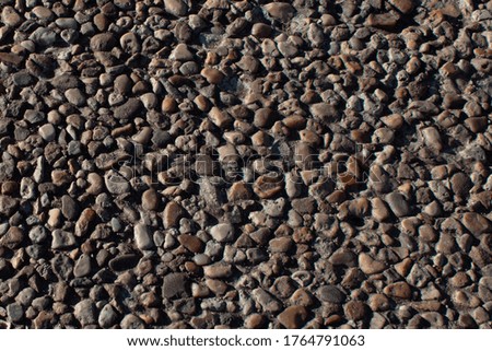 architectural texture of small brown stones