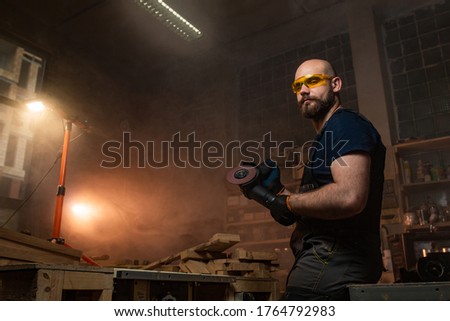the master on metal works with the device which cuts metal. photo for advertising devices for craftsmen. construction devices. photo for advertising. metal workshop
 

 
