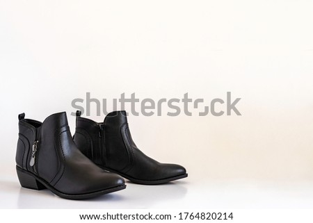 Cowboy boots on white background with copy space.