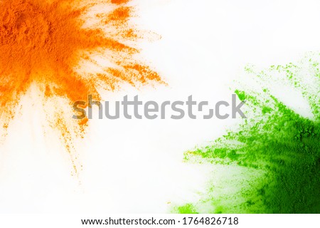 Orange and green color powder splash. Concept for India independence day, 15th of august. Royalty-Free Stock Photo #1764826718