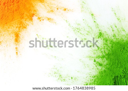 Orange and green color powder splash. Concept for India independence day, 15th of august. Royalty-Free Stock Photo #1764838985
