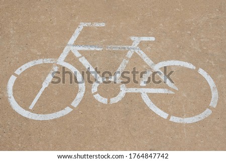 bike sign painted on the pavement