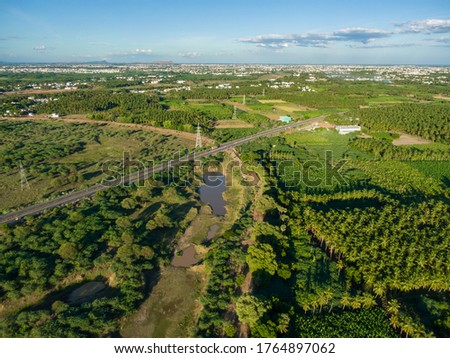 drone shot aerial view agricultural fields coconut trees plantain symmetry sunny day madurai india beautiful 