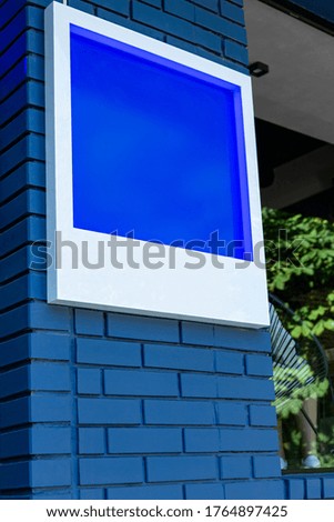 Mock up sign on a blue brick wall
