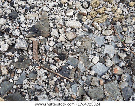 pieces of stones, glass and construction debris