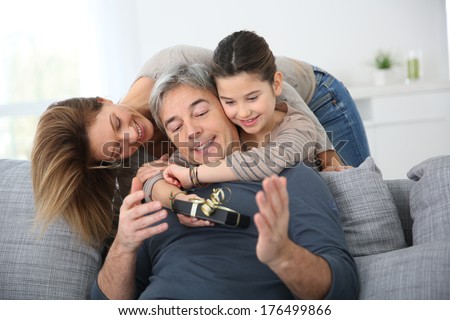 Woman with daughter celebrating father's day